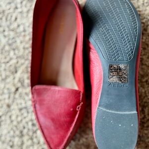 Deep maroon Maryjane type shoes, red slip on’s and hard sole slipper type shoes